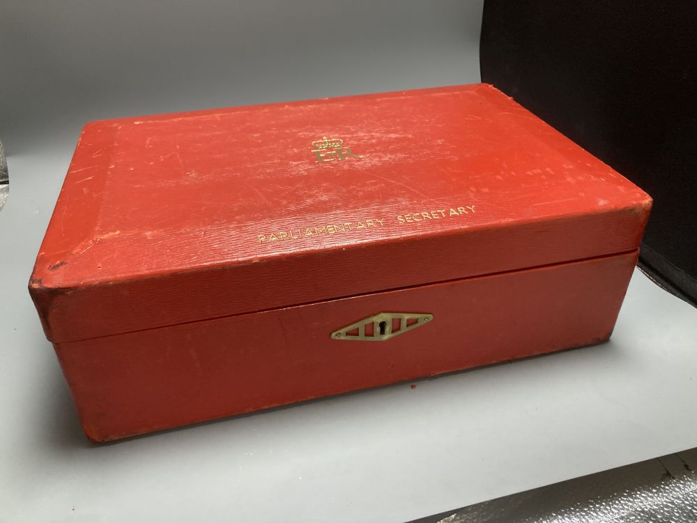 An antique parliamentary red leather despatch box and one other black box